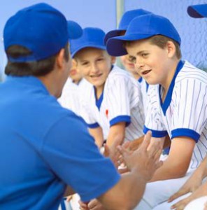 baseball coach talking to players