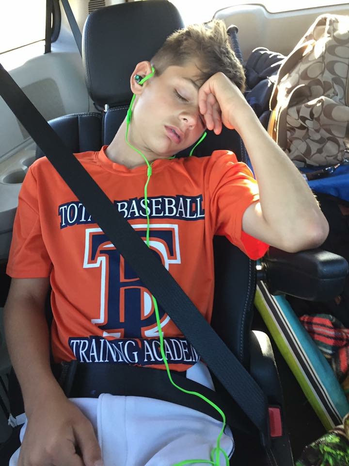 boy sleeping in back seat