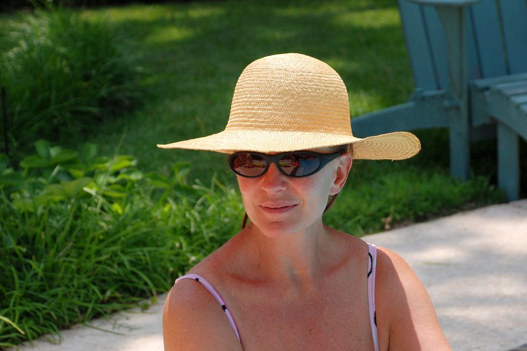 woman in floppy hat