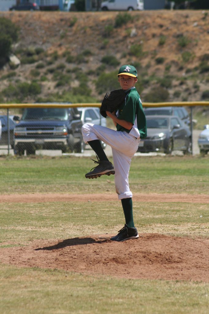 youth pitcher throwing