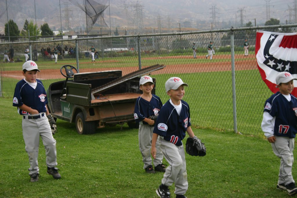 young baseball players having fun