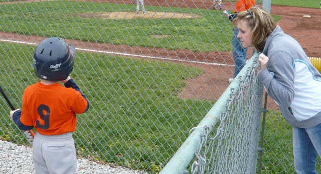 mom talking to baseball kid