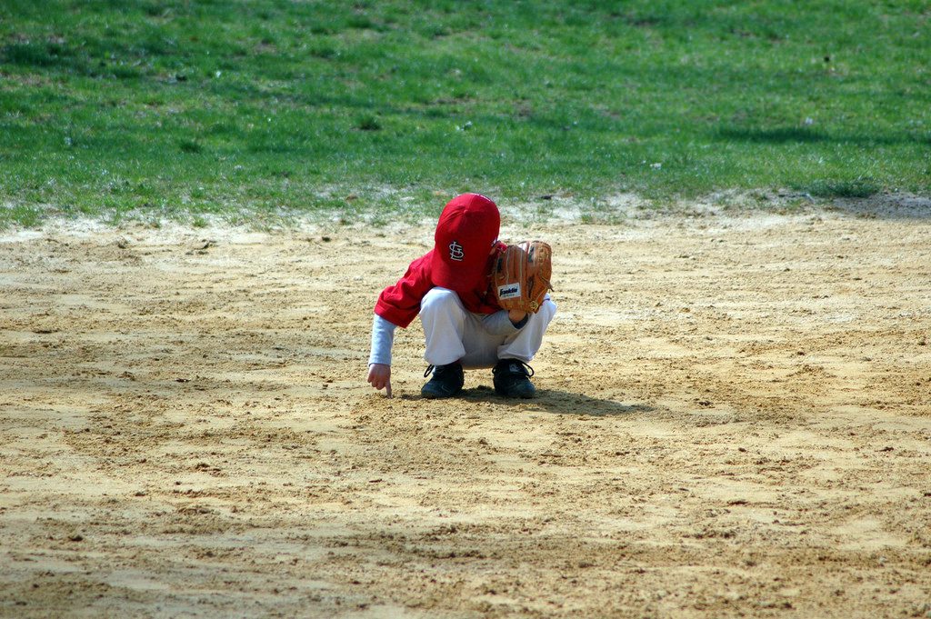 baseball player playing with dirt