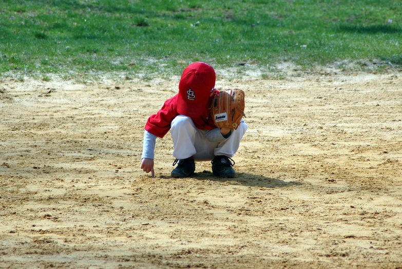 baseball player playing with dirt