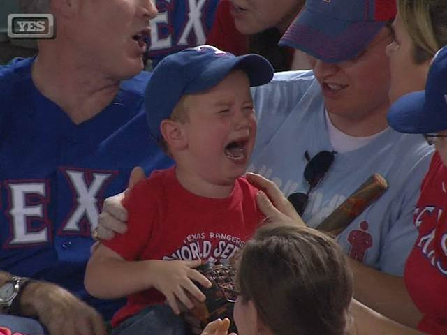 boy crying at baseball game