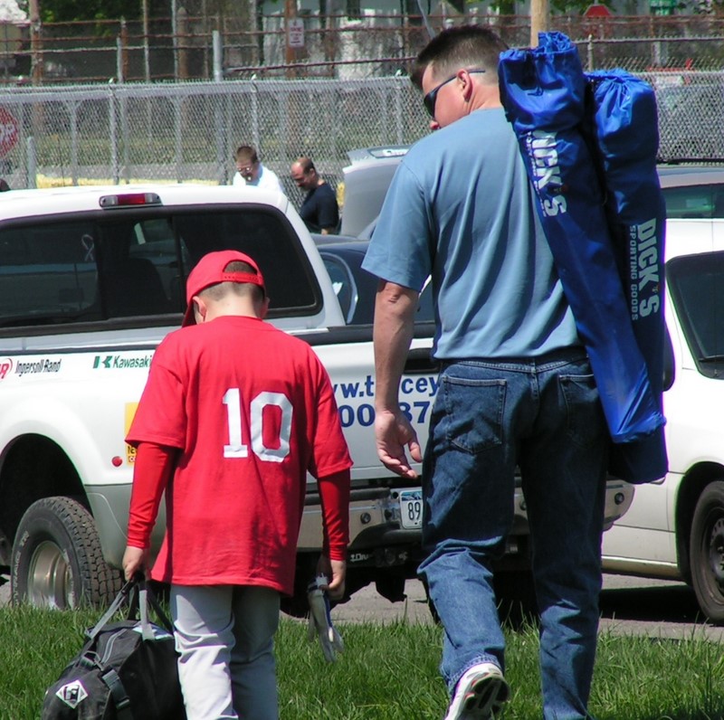 father and son after baseball game