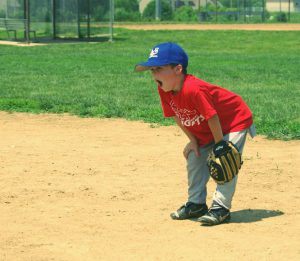 young baseball player yawning