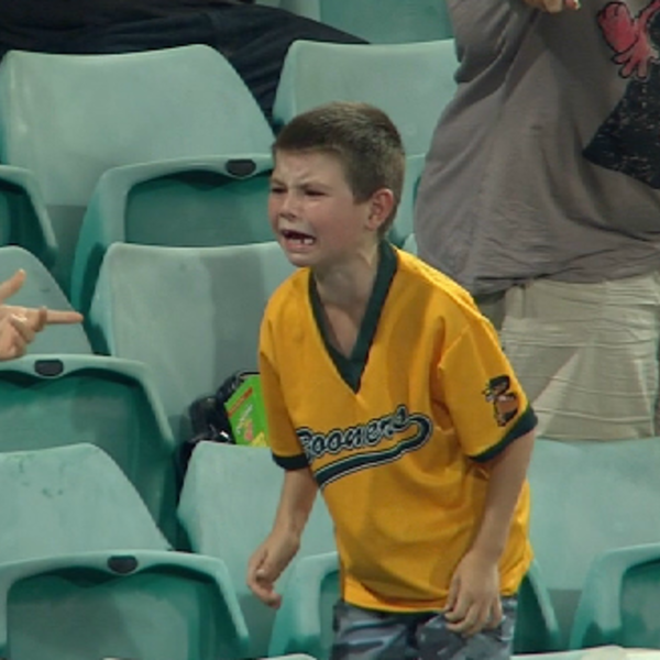 boy crying at baseball game