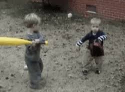 toddlers playing baseball