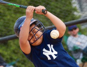 kid about to get hit with the ball