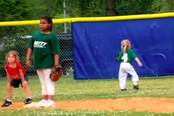 girl in outfield runs the wrong way