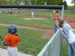 mom talking to baseball player