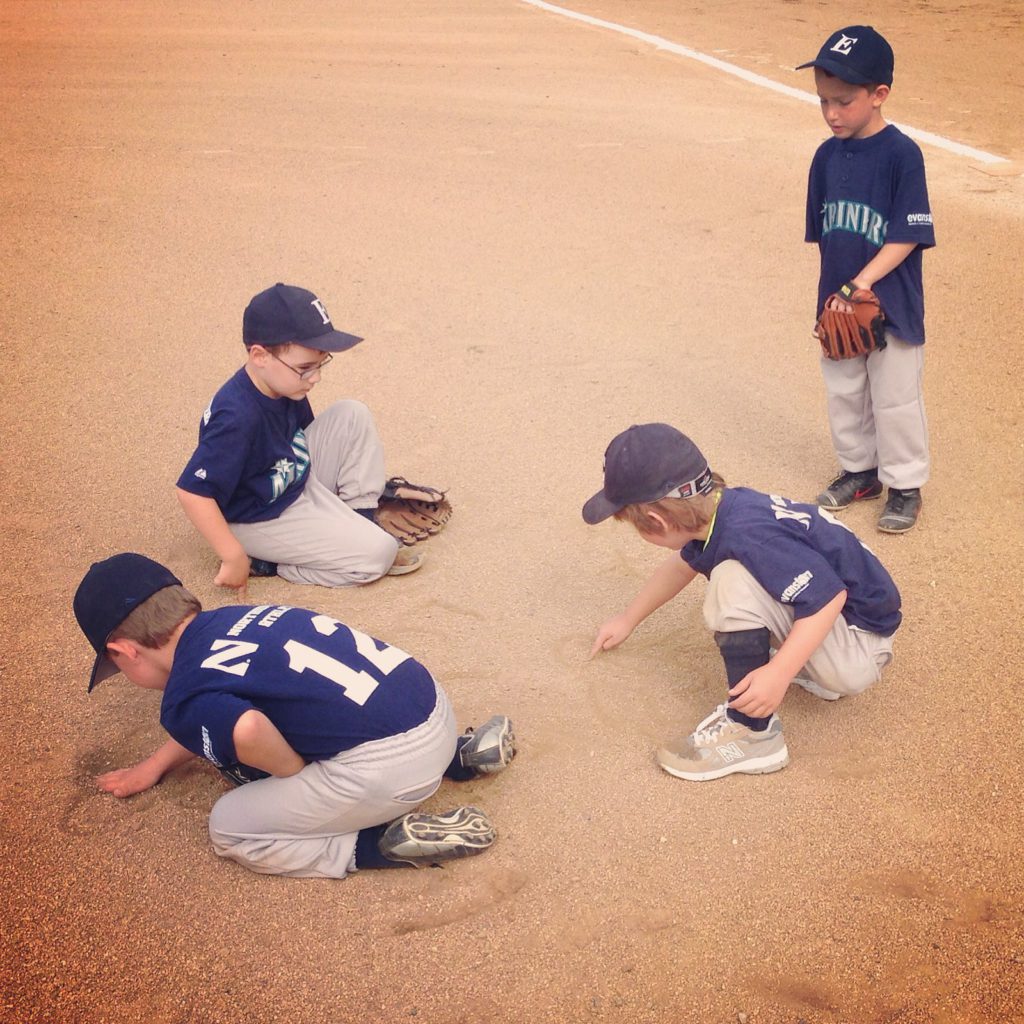 baseball kids playing in the dirt