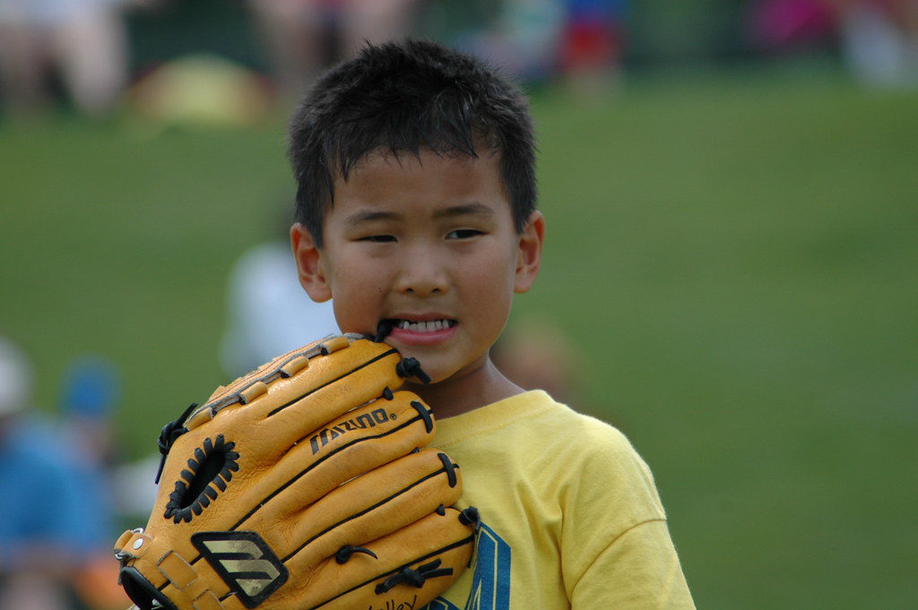 chewing on a baseball glove