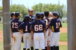 baseball coach talking to team
