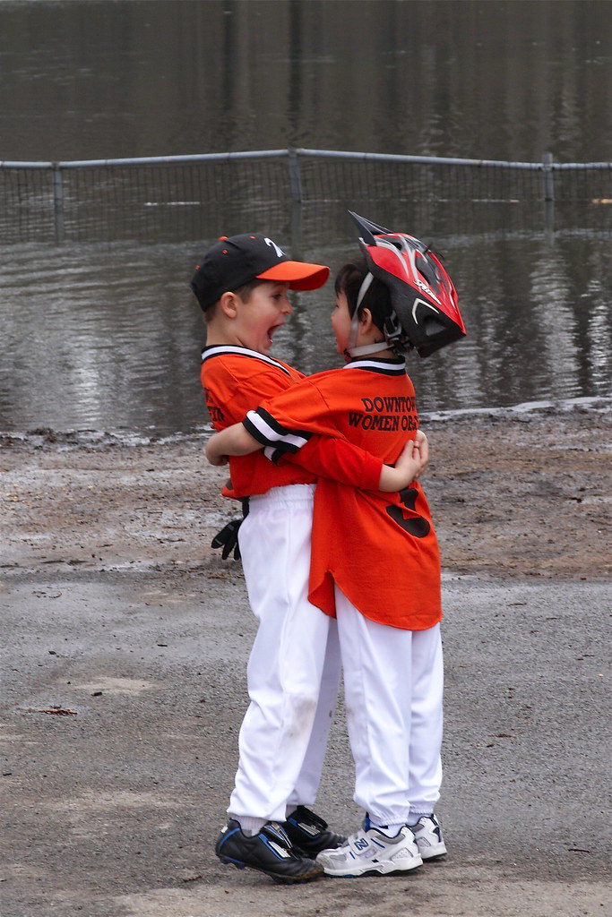 cute baseball kids hugging