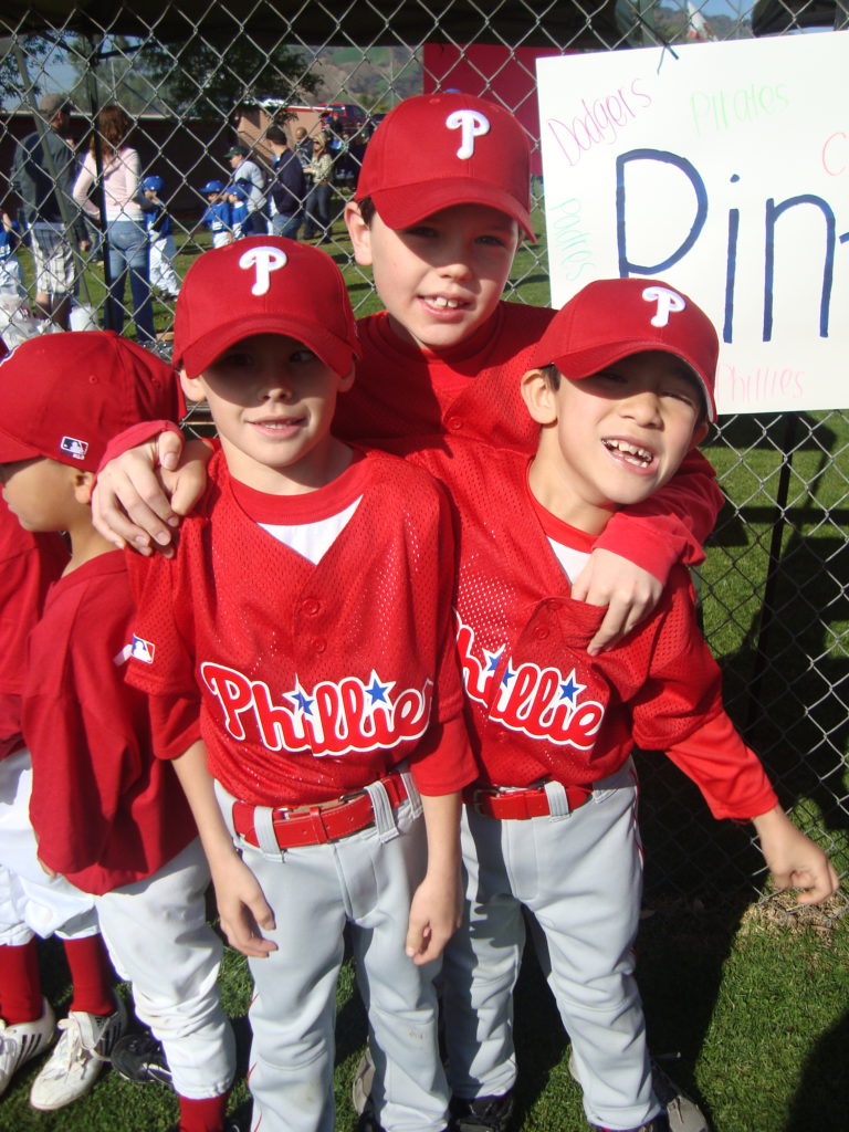 baseball boys in phillies uniforms