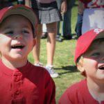 2 baseball kids in red uniforms