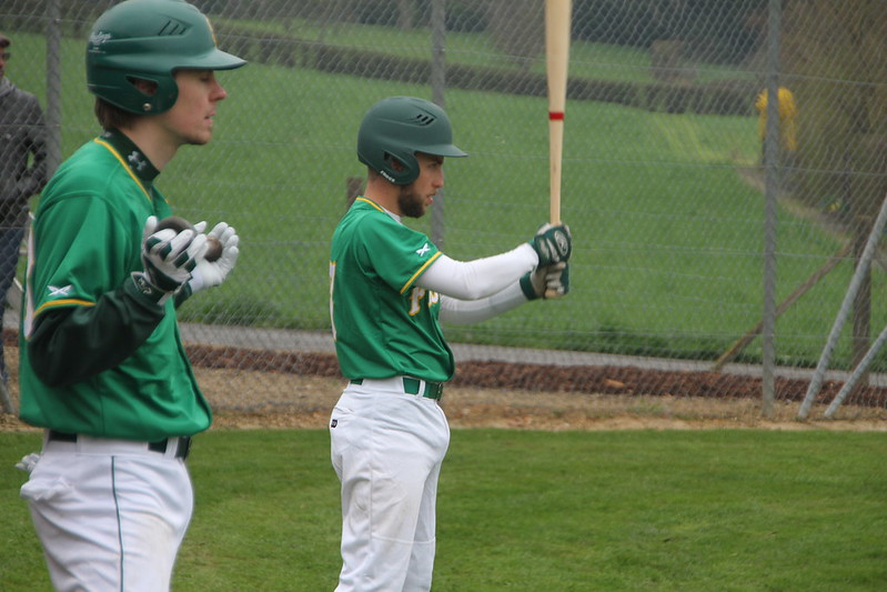 batters in green jerseys
