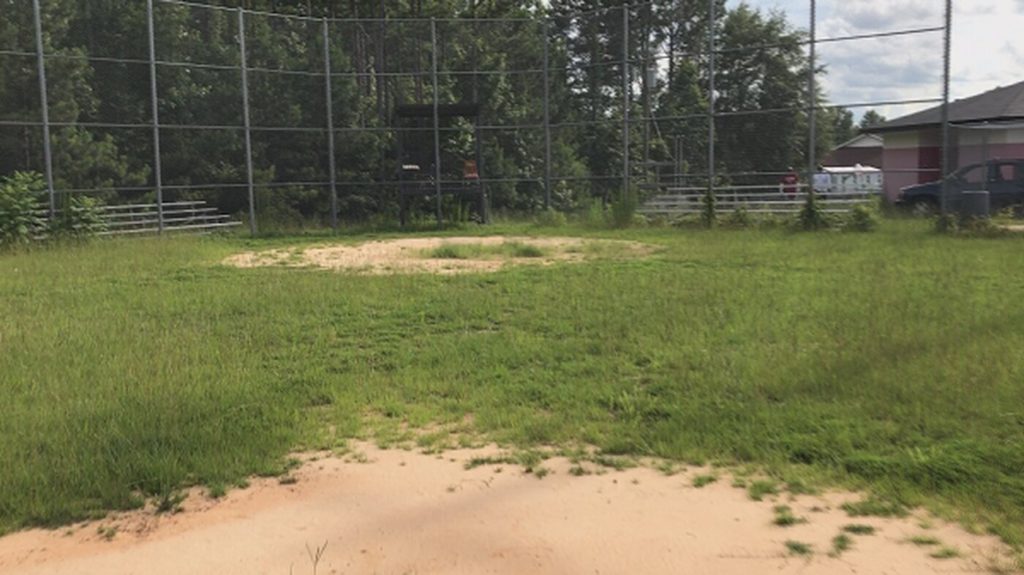 unmanicured baseball field